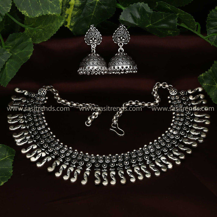 Traditional oxidised silver jewellery set with crescent moon pendants and ethnic earrings