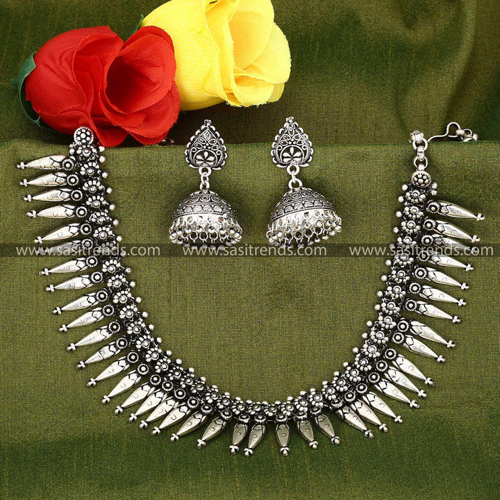 Ethnic choker in oxidised silver with traditional design and matching earrings 