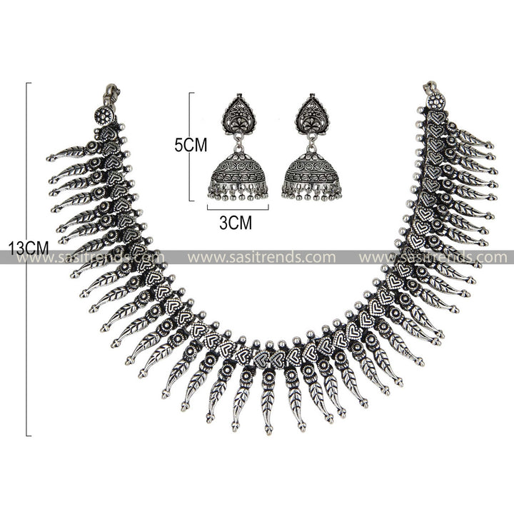 Leaf design oxidised silver jewellery set with elegant ear adornments 