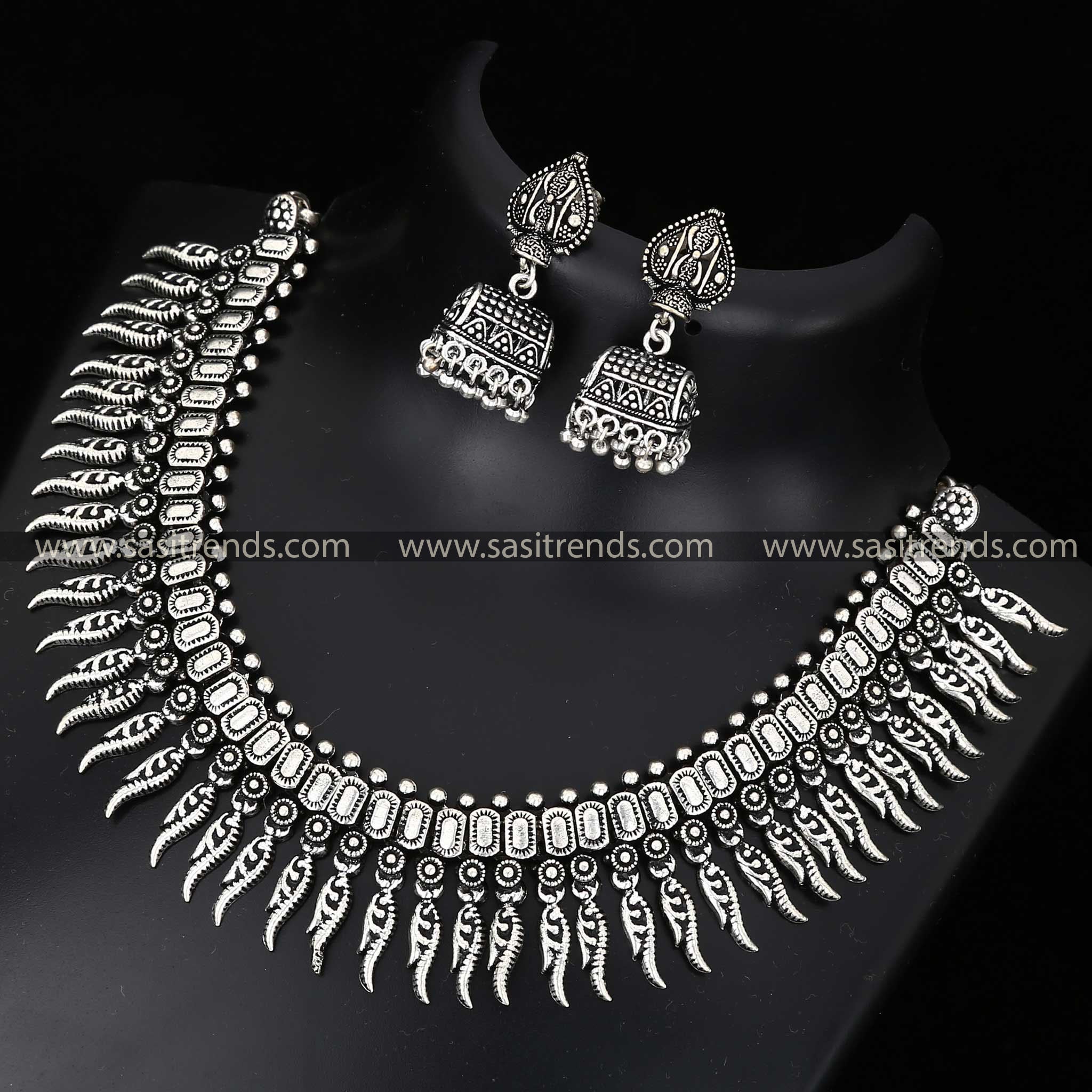 Oxidised silver set with circular motifs and traditional earring design navarathiri elegance