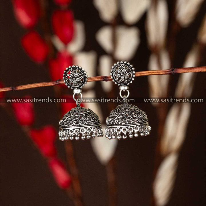 Oxidised silver jhumka earrings with a floral mandala top, a captivating piece from our ethnic collection