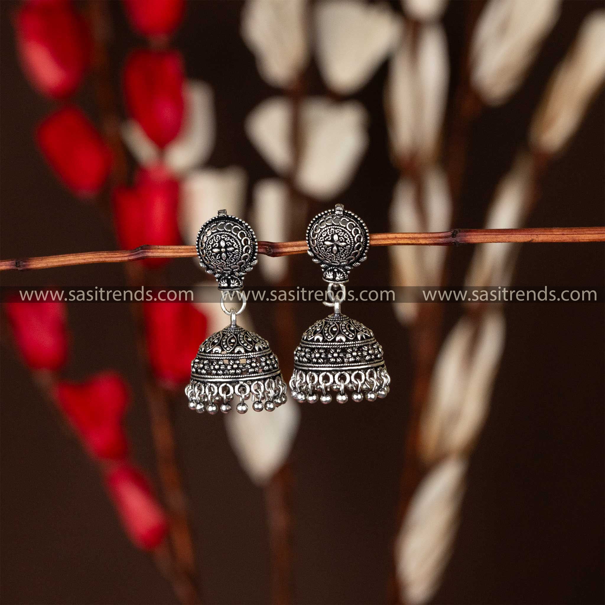 Oxidised silver jhumka earrings featuring a floral mandala-inspired stud design with a classic jhumka drop, perfect for ethnic accessorizing