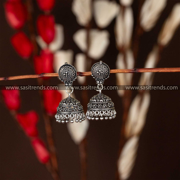 Oxidised silver jhumka earrings featuring a floral mandala-inspired stud design with a classic jhumka drop, perfect for ethnic accessorizing