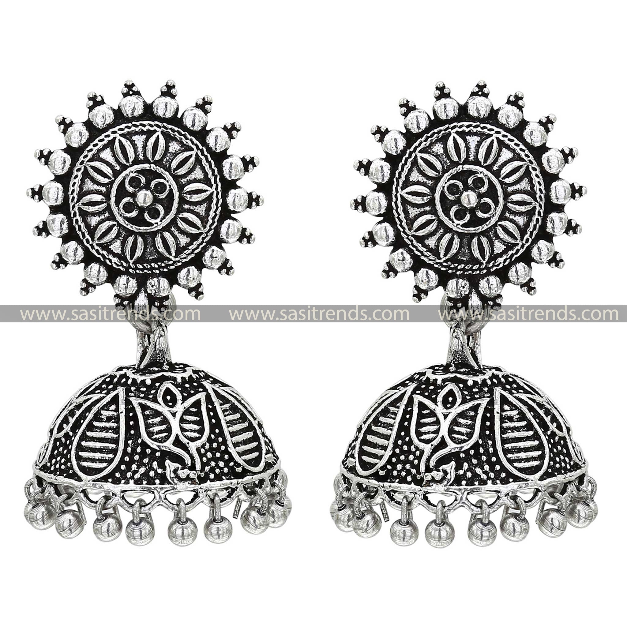 Traditional oxidised silver jhumkas featuring chara tops adorned with a delicate leaf design, perfect for ethnic wear