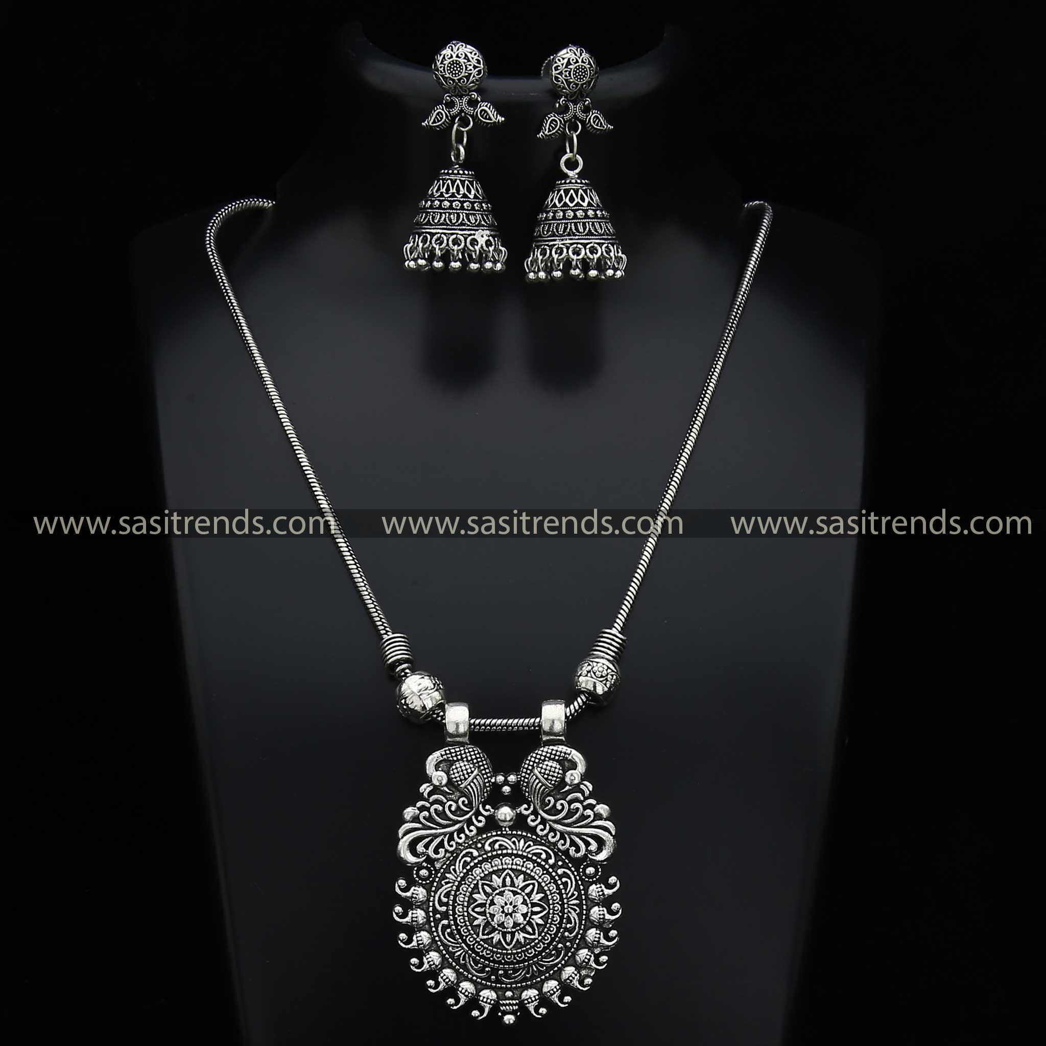 Detailed Mayurika Oxidised Silver Peacock Pendant and Jhumka Earrings Jewellery Set - Navarathiri Collections