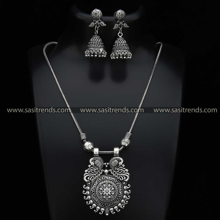 Detailed Mayurika Oxidised Silver Peacock Pendant and Jhumka Earrings Jewellery Set - Navarathiri Collections