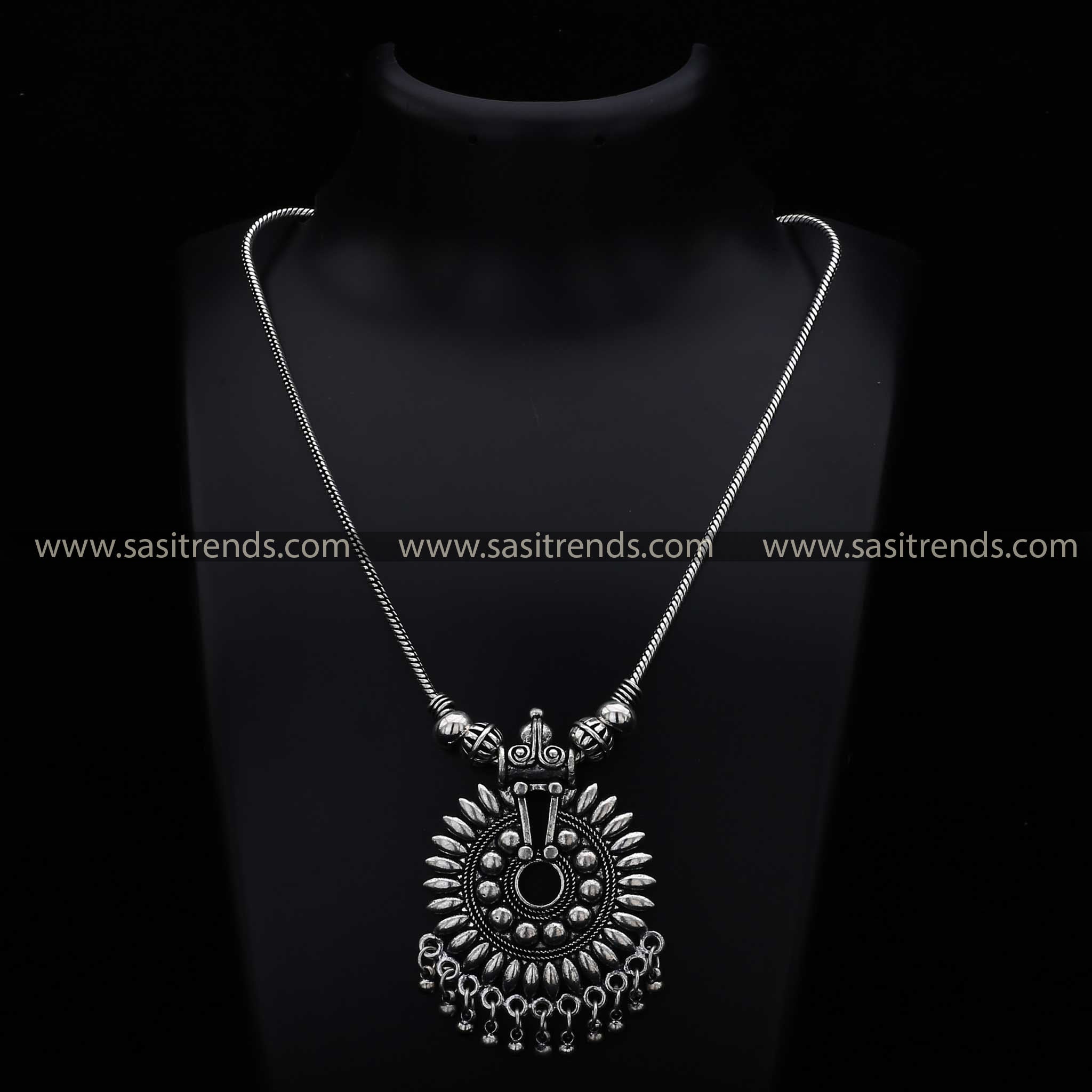 Ethnic oxidised necklace with sunburst pattern pendant and spherical beads navarathiri wear