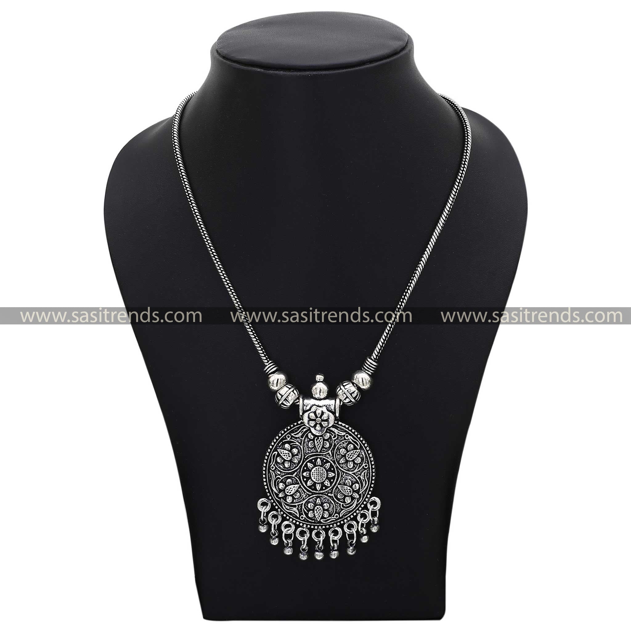 Traditional motif in oxidised silver necklace with decorative beads navarathiri elegance