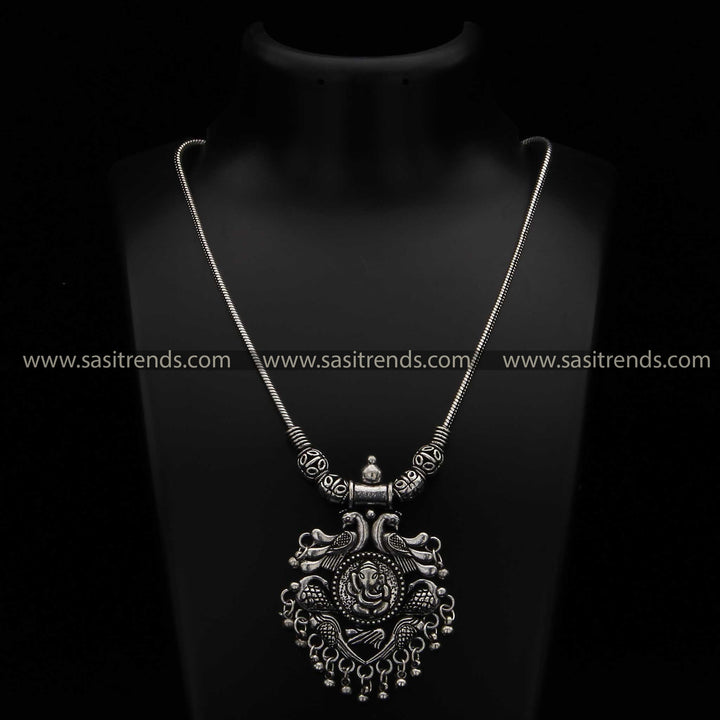 Oxidised necklace with intricate Lord Ganesha and peacock patterns navarathiri collection