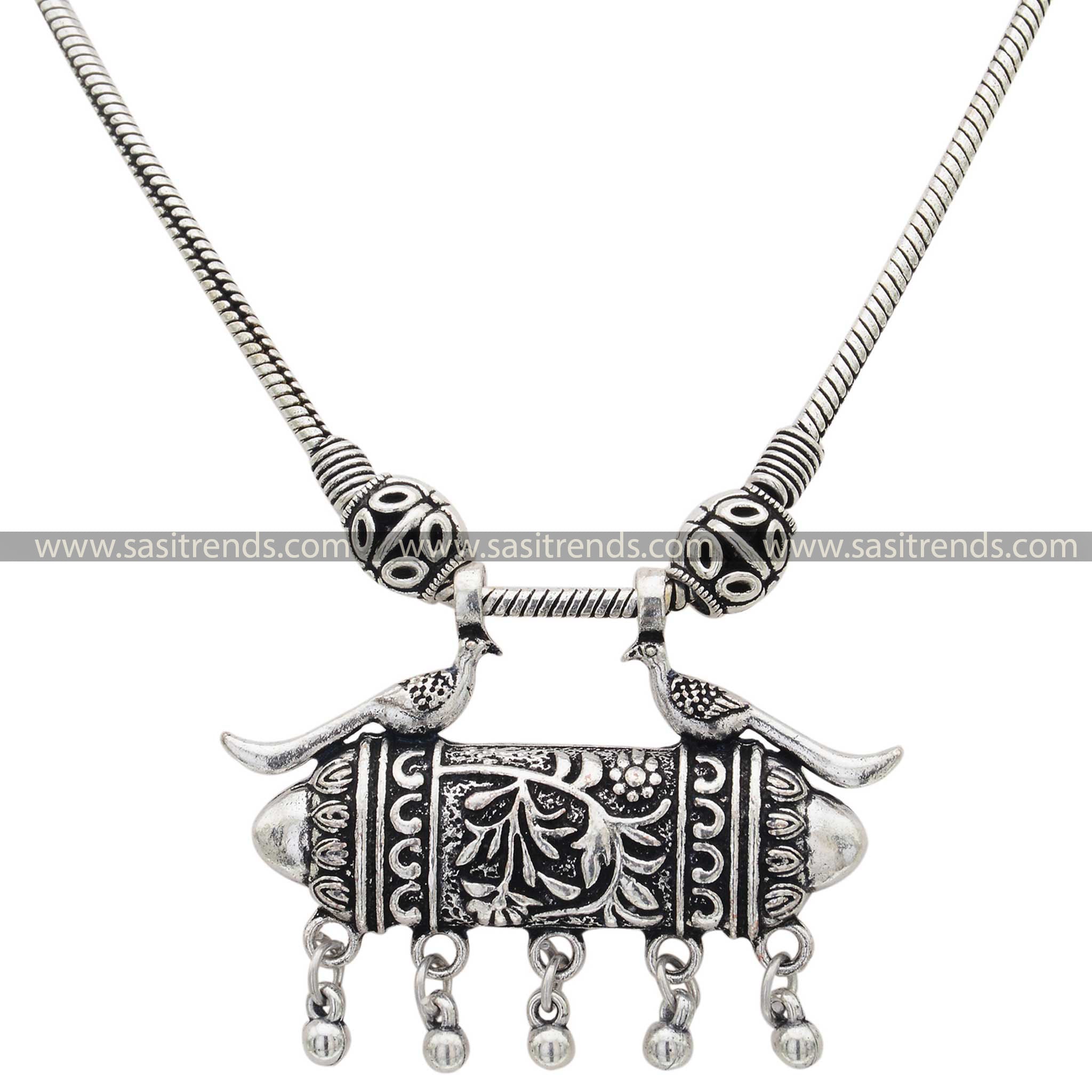 Ethnic oxidised silver necklace with detailed peacock design and dangle accents