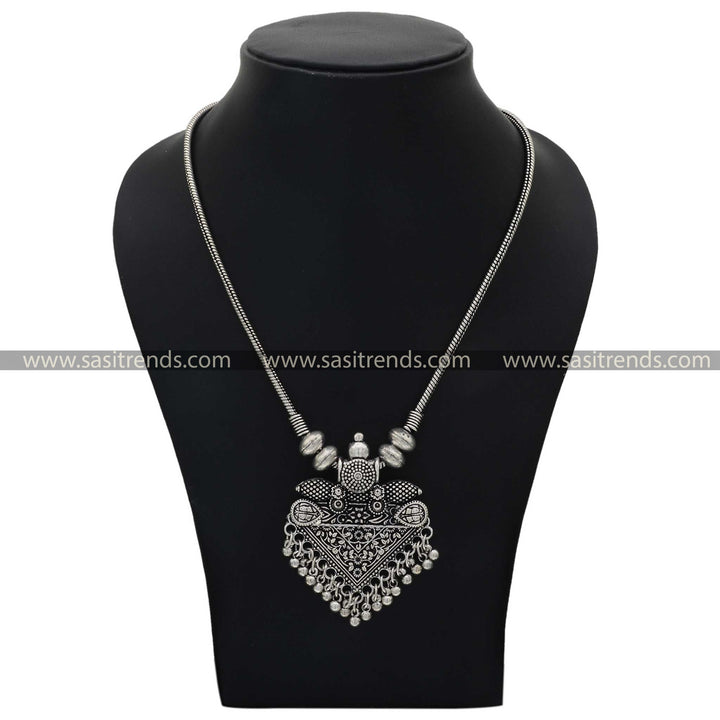 oxidised statement necklace with ornate pendant and traditional motifs