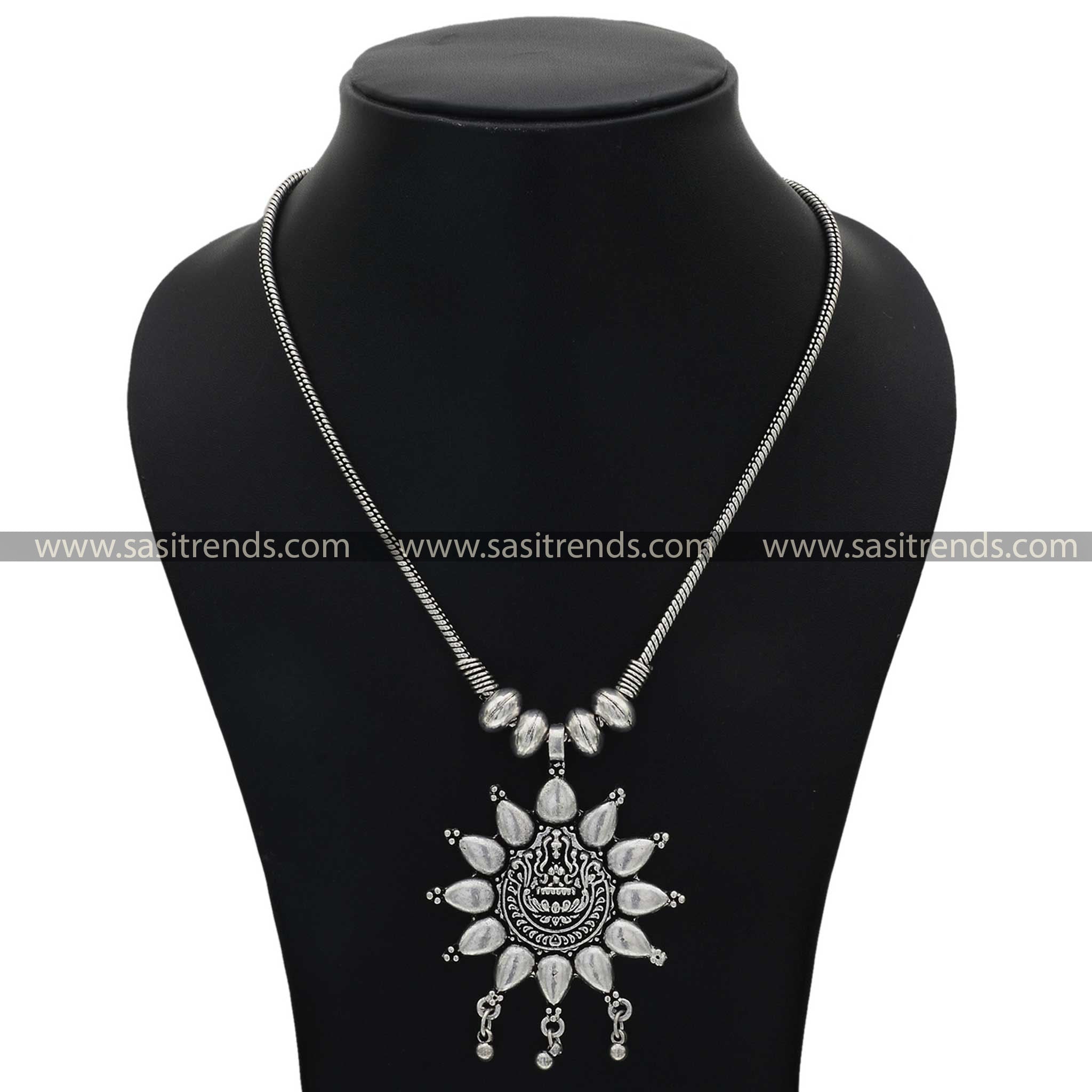 Elegant silver necklace featuring a central Lakshmi motif with petal-like adornments