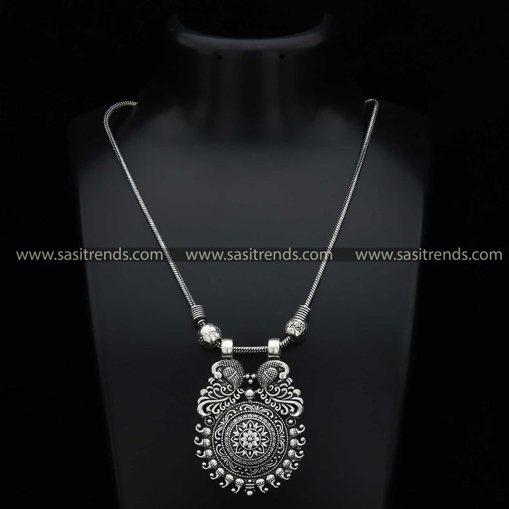 Sasitrends - Mayurika Floral and Mango Motif Peacock Pendant Necklace Chain in Oxidised Silver and Antique Gold