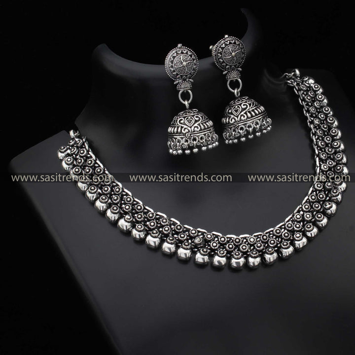 Madhura Jewellery Set with Signature Jhumka in Oxidised Silver and Antique Gold