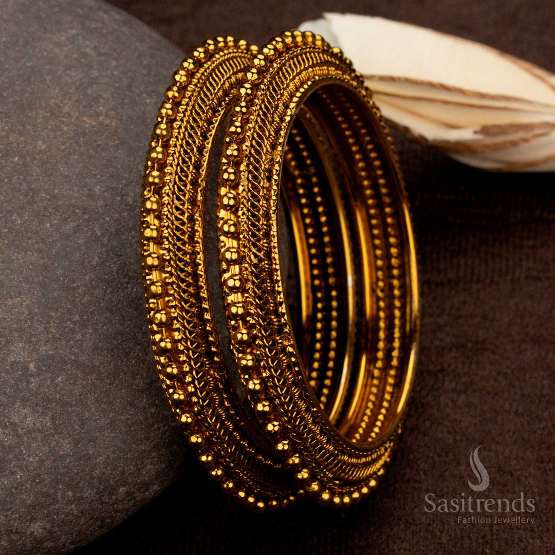 Gorgeous antique gold-plated bangles with a detailed mango design and rich ethnic motifs, offering a royal and traditional jewellery charm - Sasitrends