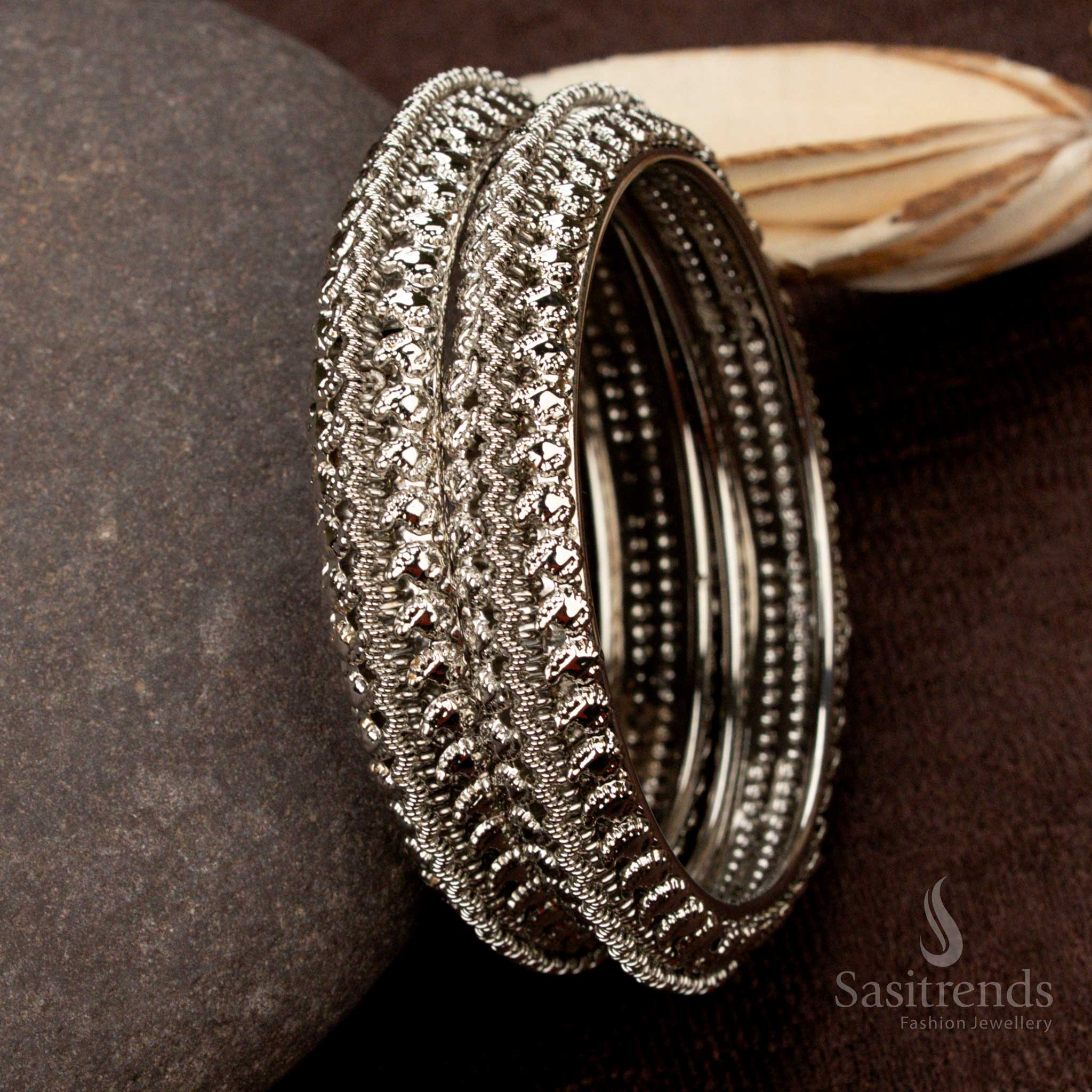 Elegant oxidised silver-plated bangles featuring a classic mango design with intricate carvings, a handcrafted ethnic jewellery piece perfect for vintage lovers - Sasitrends