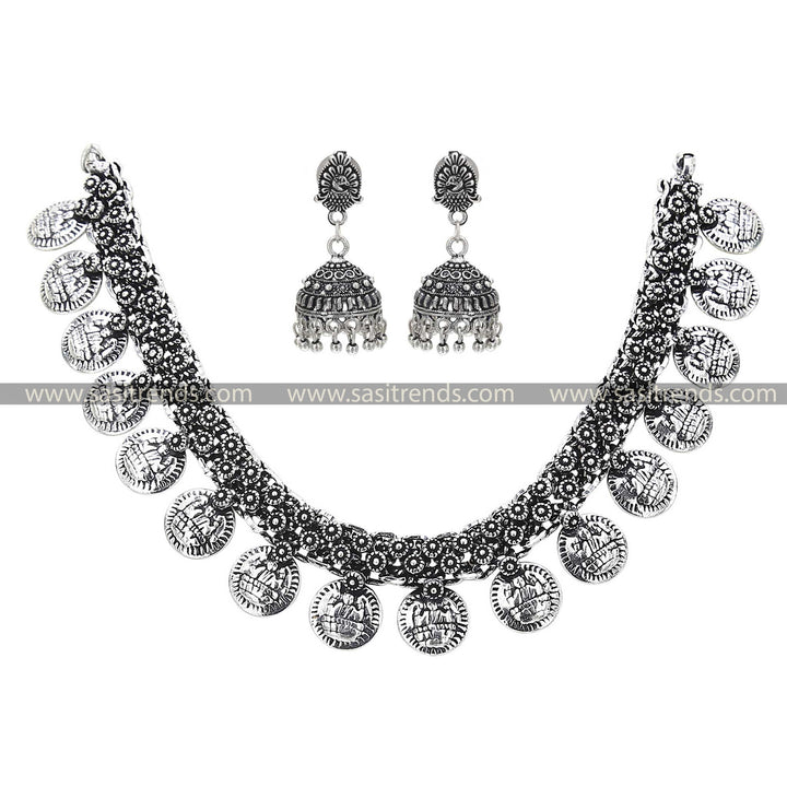 Oxidised Silver Gapped Coin Necklace with Peacock Jhumka Earrings Set, a unique blend of divinity and art in oxidised jewellery