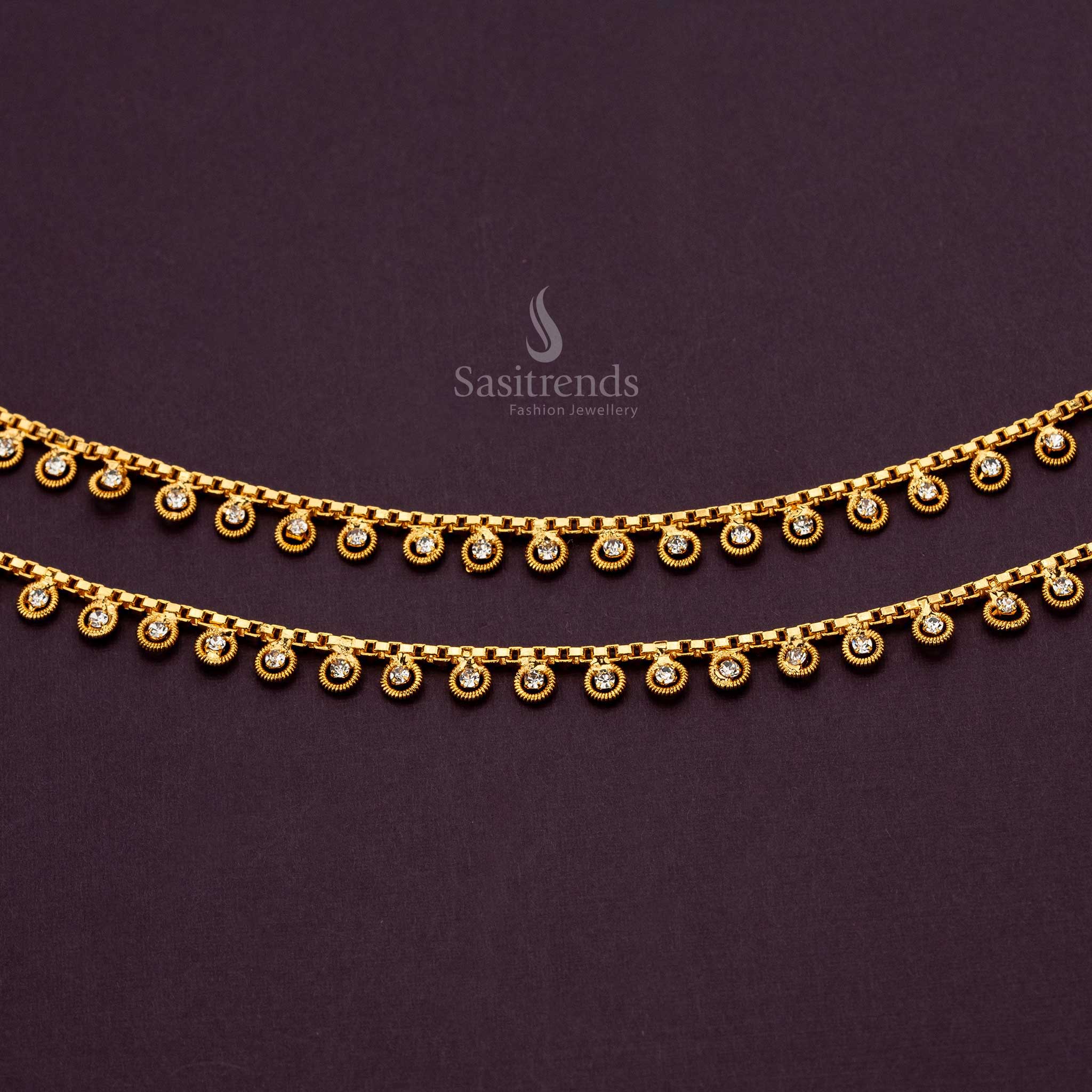 Close-up of luxurious anklets featuring gold loops and accents White AD Stones - Sasitrends