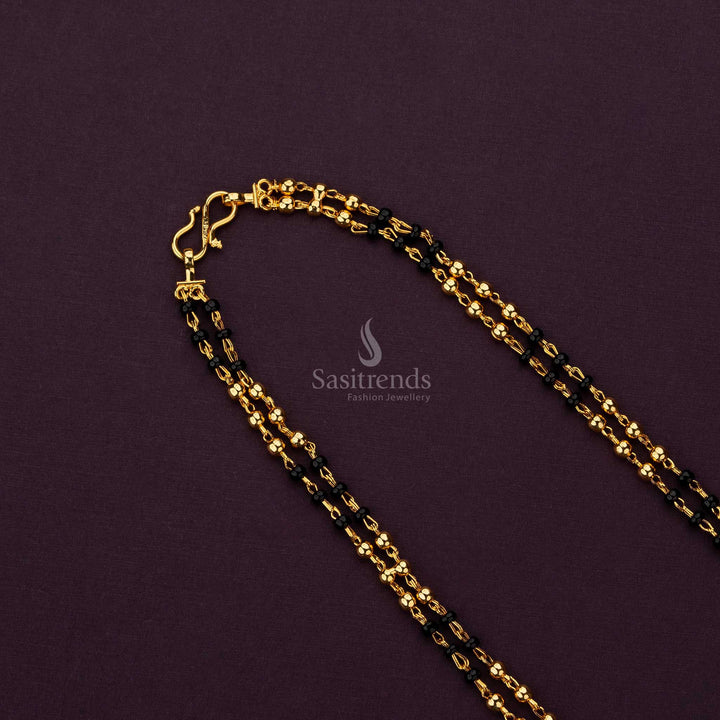 Micro gold plated chain with radiant black and gold beads, ideal for festive wear - Sasitrends