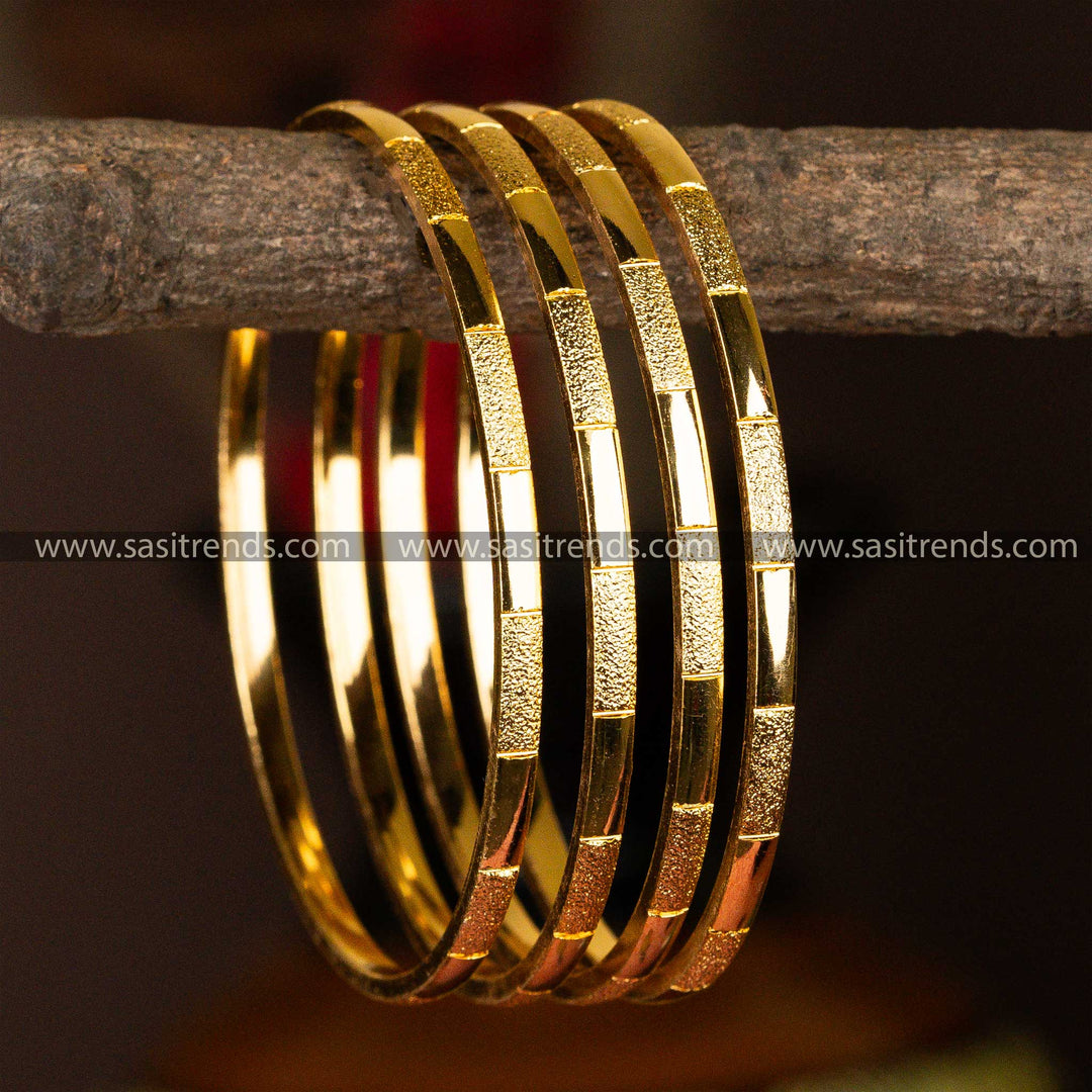 A 4-piece set of micro gold-plated bangles with a unique textured finish