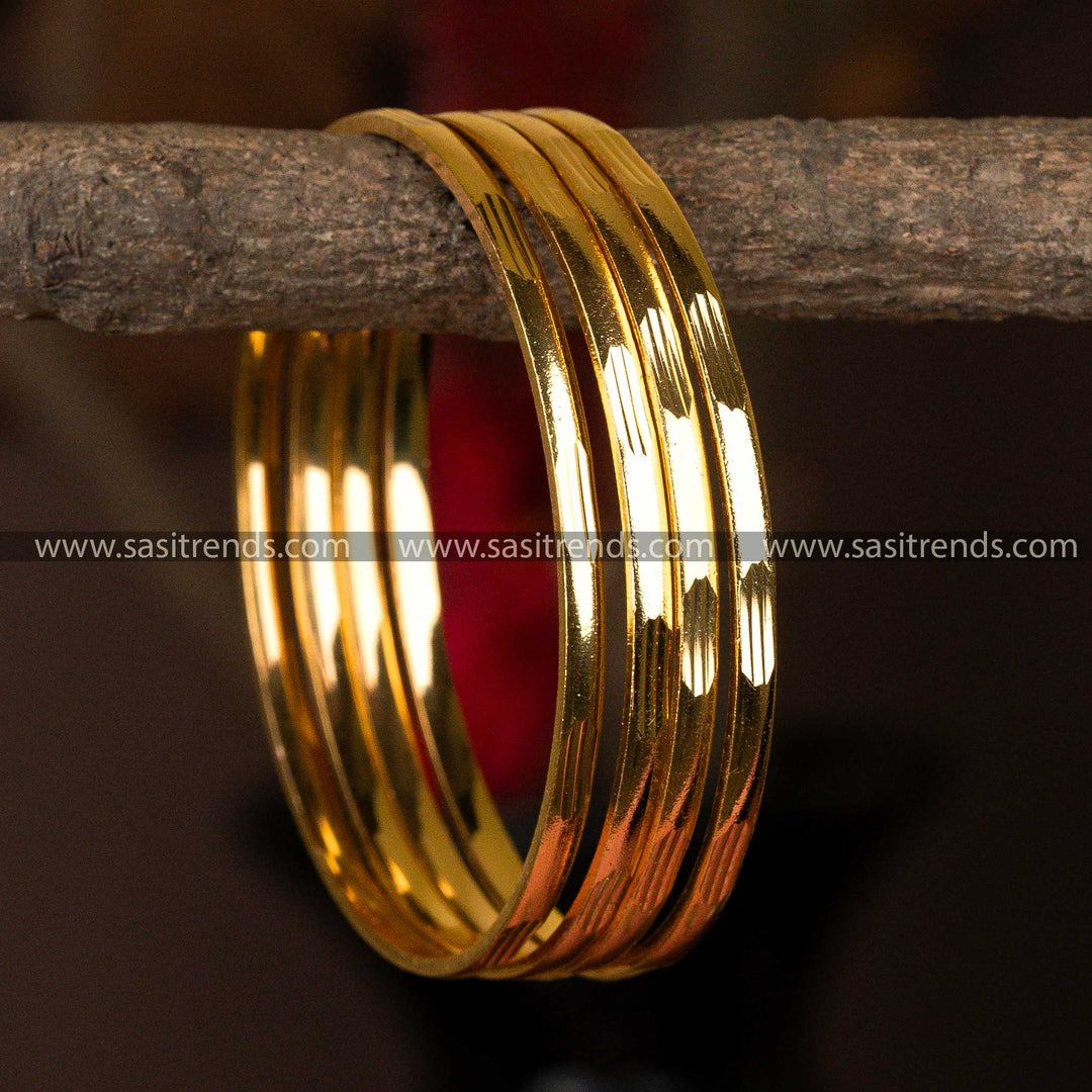 Smooth and reflective set of 4 micro gold-plated bangles with a minimalist design