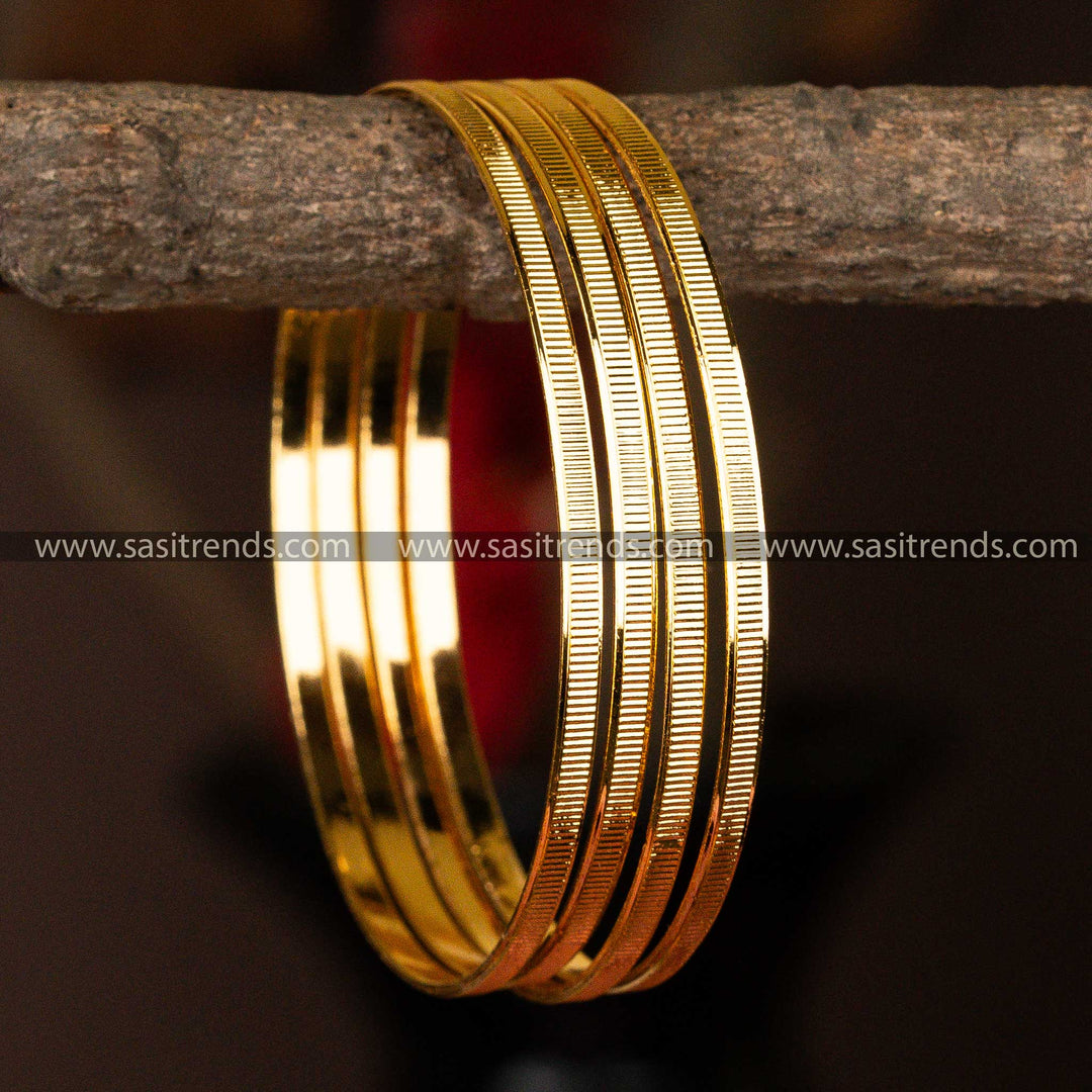 Set of 4 micro gold-plated bangles with subtle linear texturing for timeless elegance