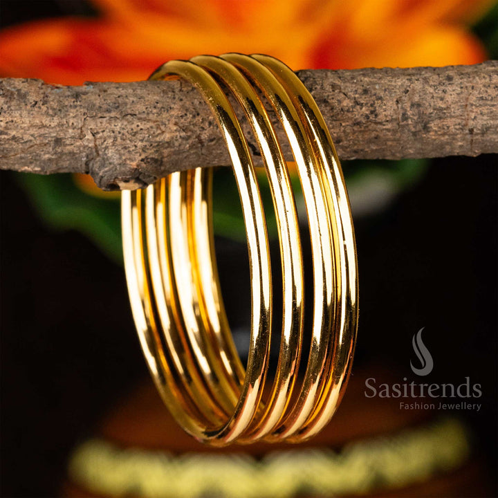 Regal One Gram Micro Gold Plated Guaranteed Plain Bangles Set of 4, designed in a Thick and Bold Style, exuding a luxurious and royal ethnic charm - Sasitrends