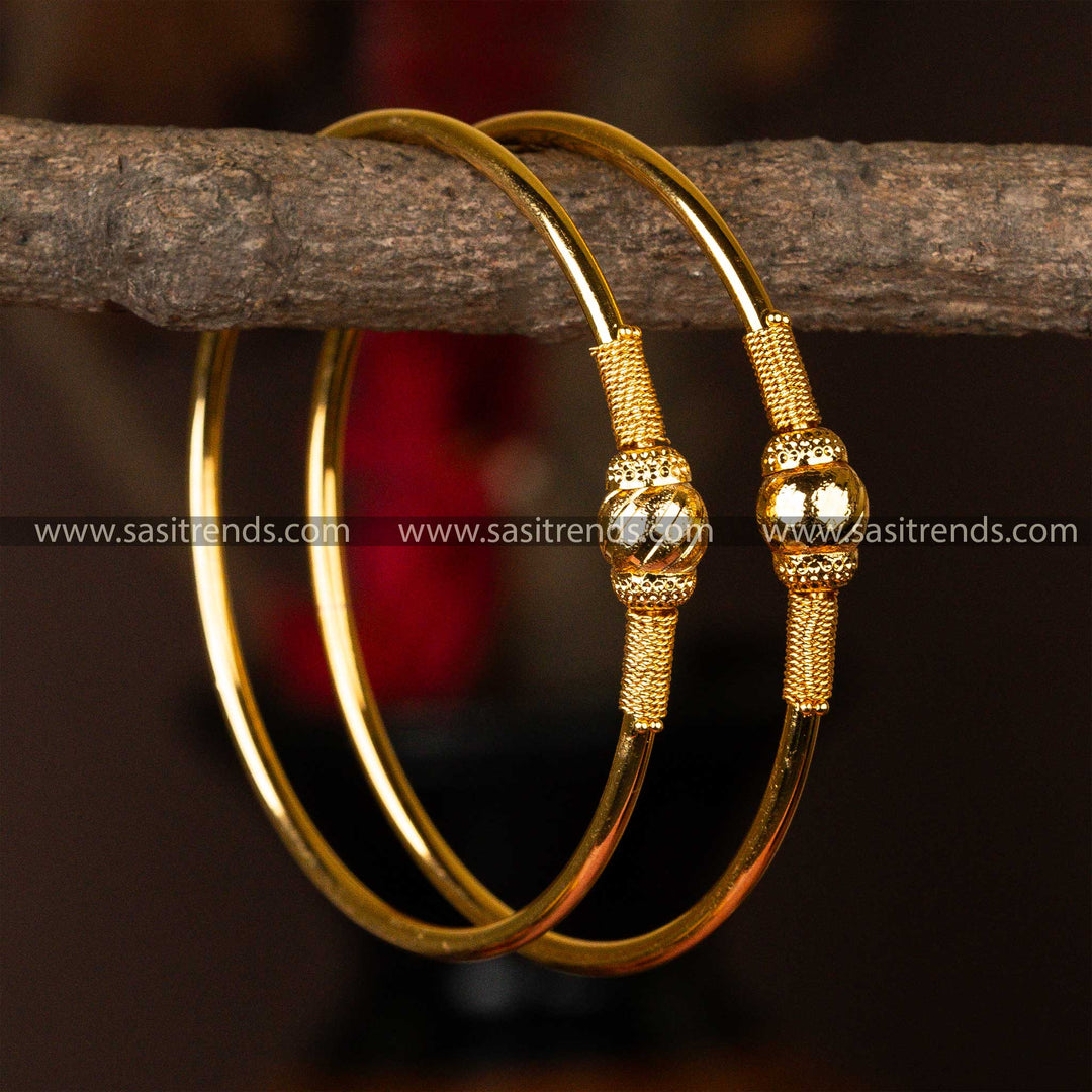 Gold-plated kada bangles with distinctive textured spheres