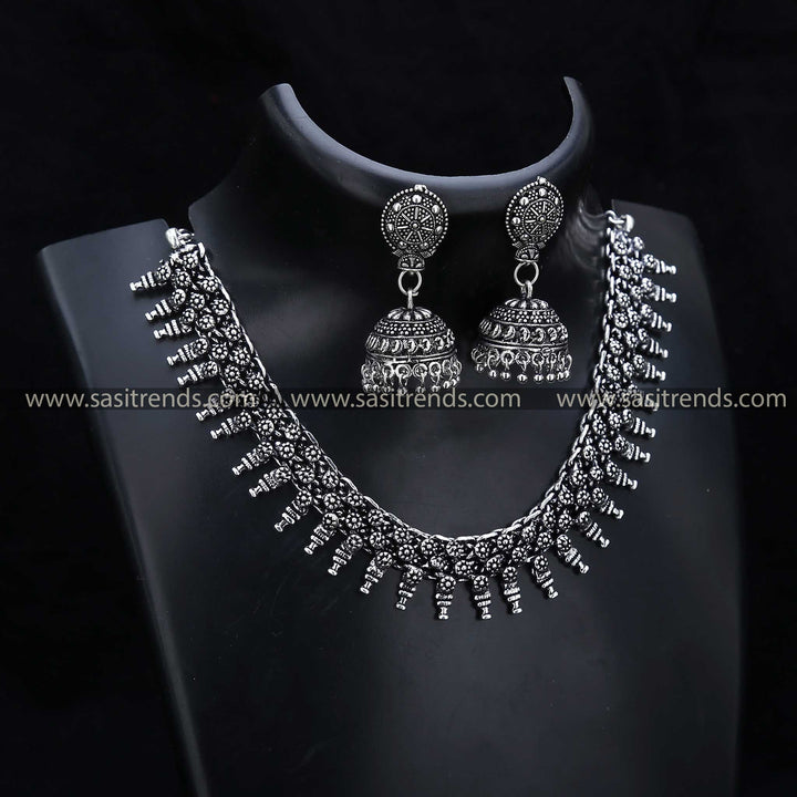 Elegant Oxidised Jewellery Set 1208A with crescent-shaped drops, paired with detailed jhumka earrings, embodying the essence of oxidised jewellery