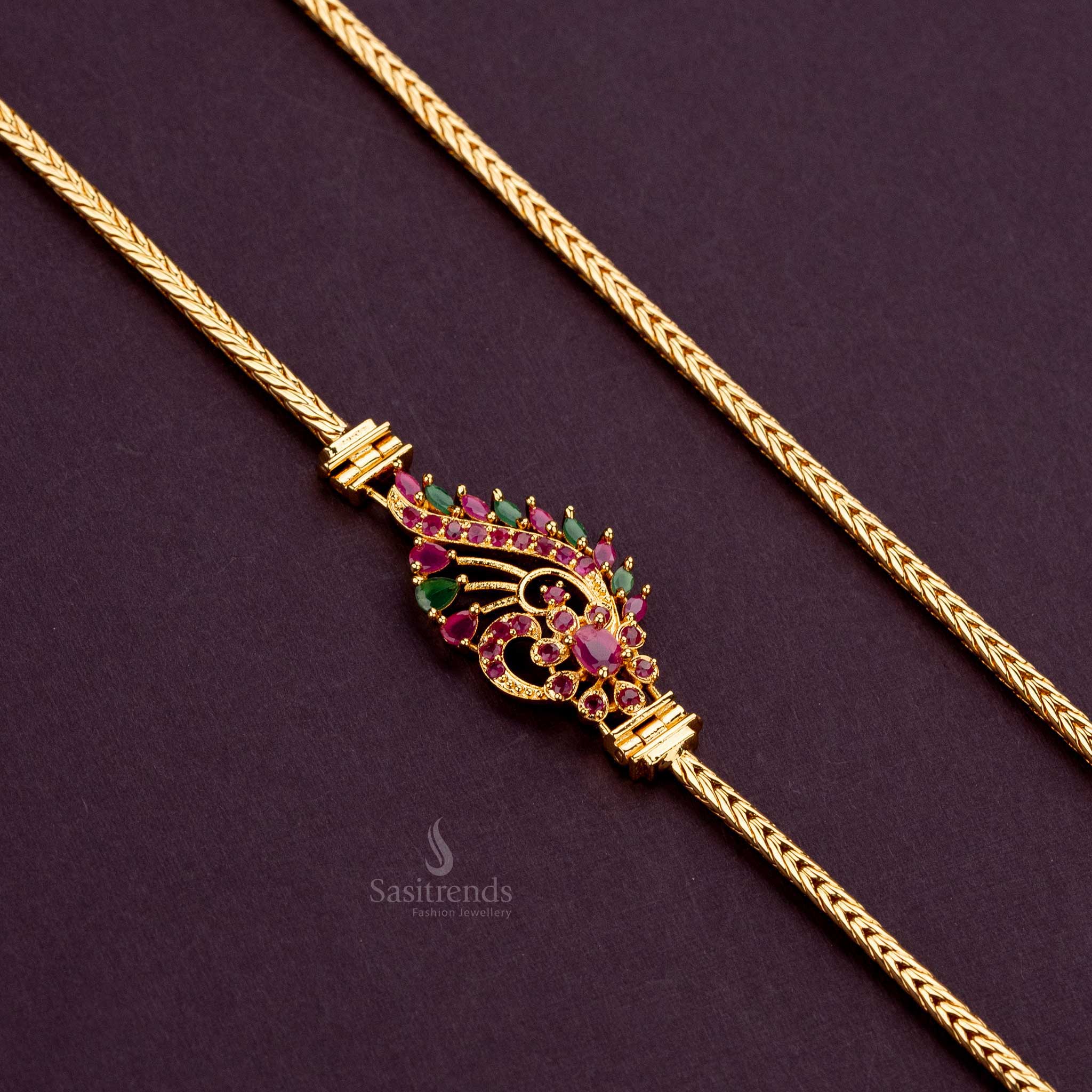 Floral mugappu chain with vibrant ruby-green AD stones, plated with 24-carat gold for a rich and timeless look - Sasitrends