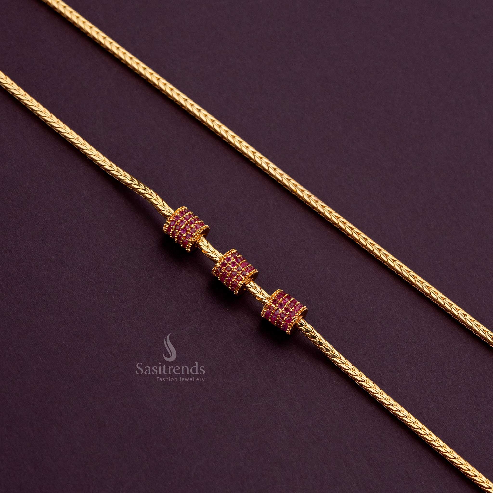 One-gram gold-plated ruby cylindrical mugappu chain, perfect for silk sarees