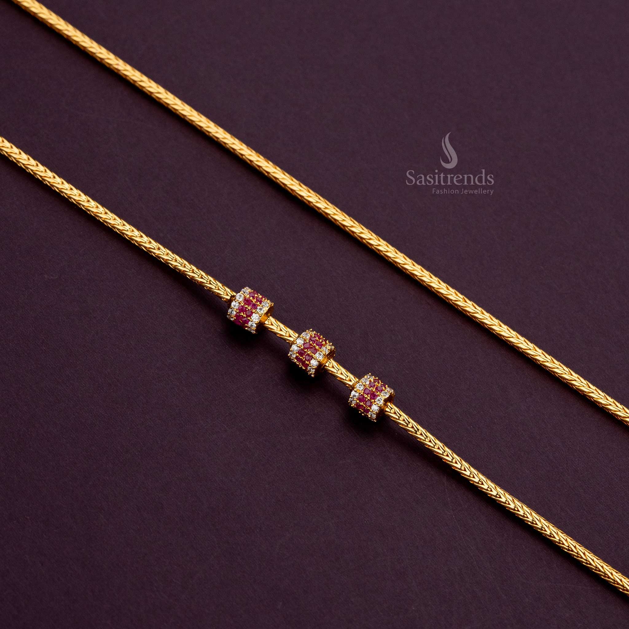 One-gram gold-plated cylindrical ball mugappu chain with white-ruby AD stones, 24 inches