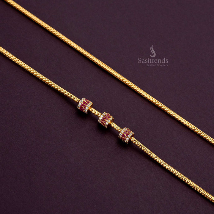 One-gram gold-plated cylindrical ball mugappu chain with white-ruby AD stones, 24 inches