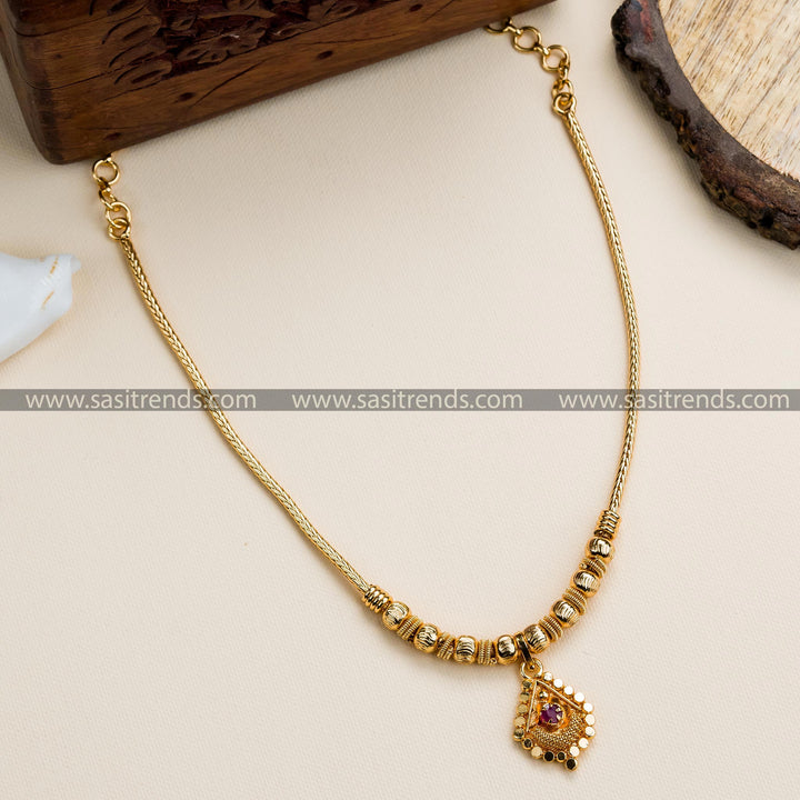 Traditional micro gold-plated necklace with a small pendant and golden beads, resembling real gold