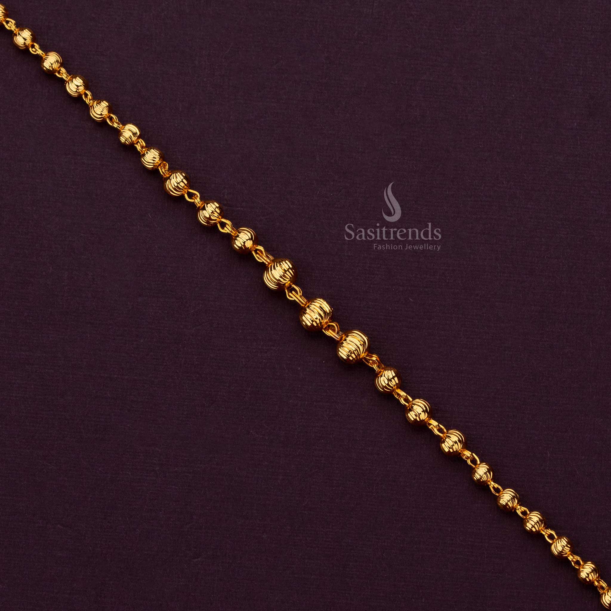 Elegant 1 gram gold plated bracelet with a unique ball design, perfect for sarees - Sasitrends