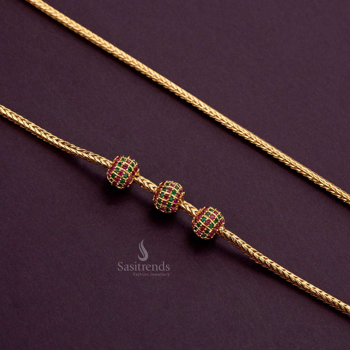 Micro gold plated mugappu chain adorned with sparkling Ruby Green AD stones - Sasitrends