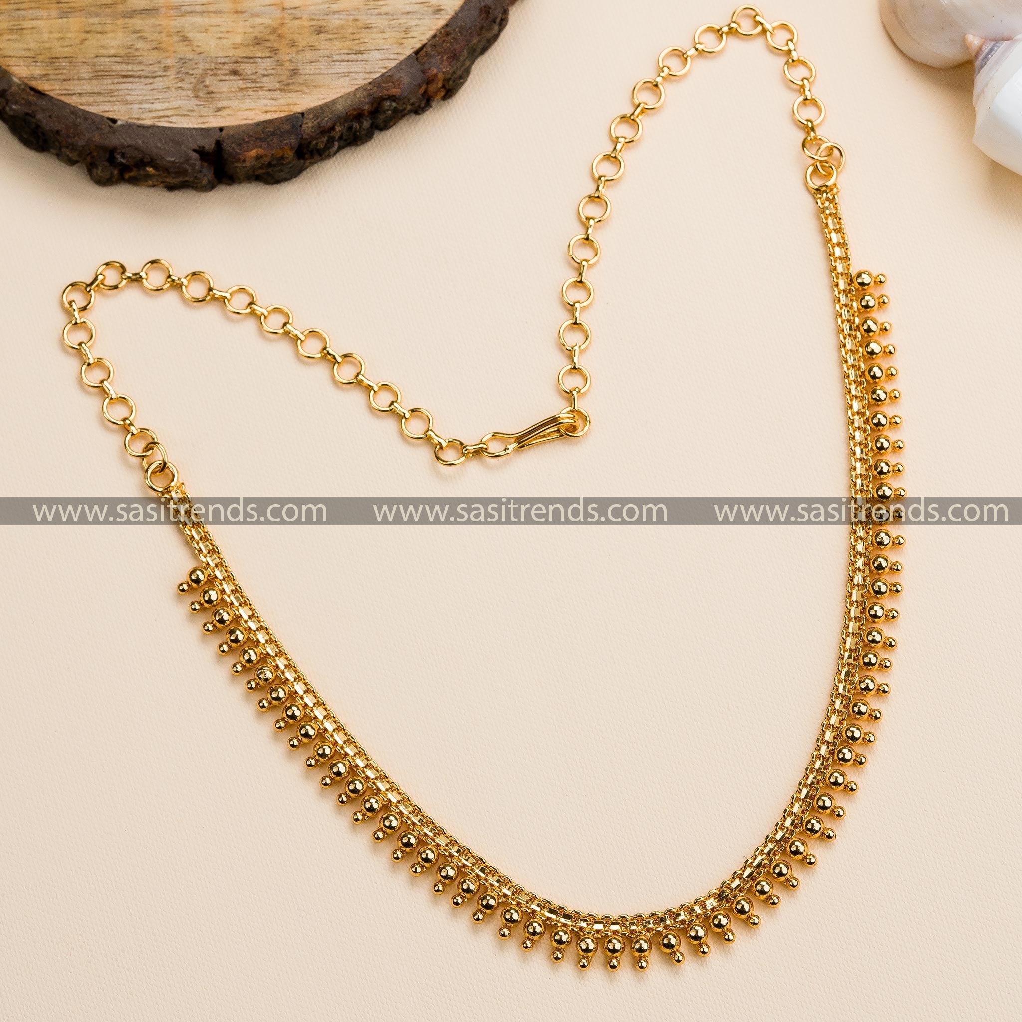 Elegant micro gold-plated golden ball necklace, perfect for pairing with traditional attire