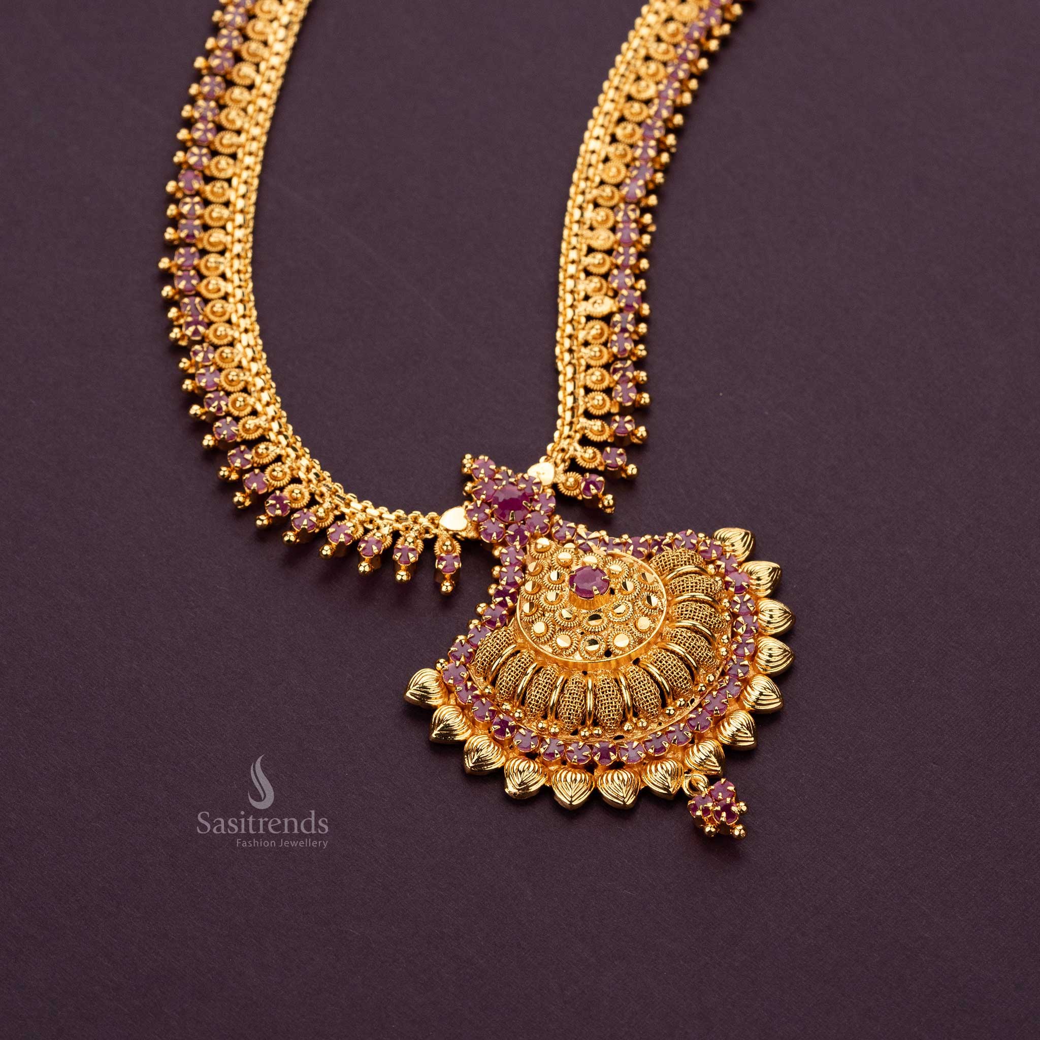 Grand ruby AD stone long haram necklace with floral pendant and gold finish  - Sasitrends