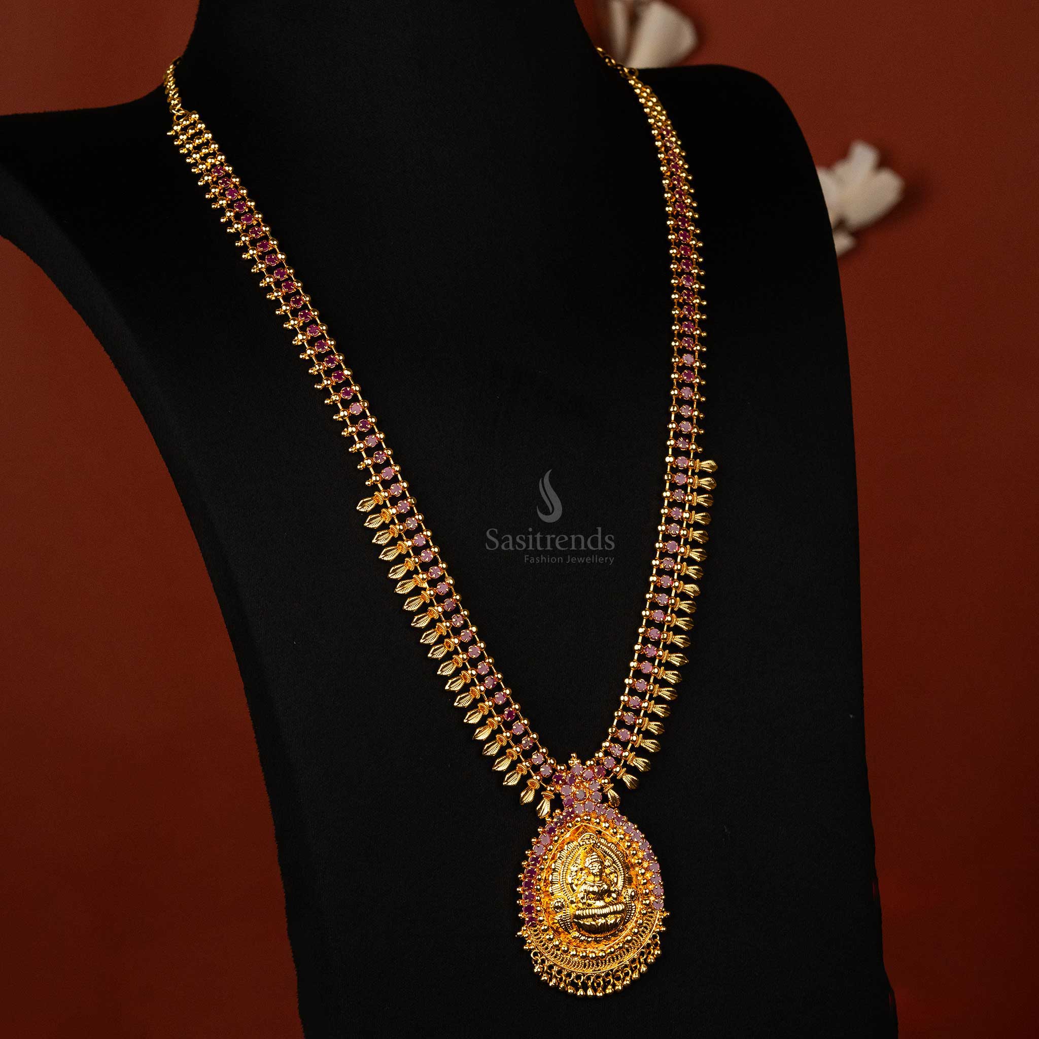 Traditional gold-plated long haram with ruby Lakshmi pendant  Sasitrends