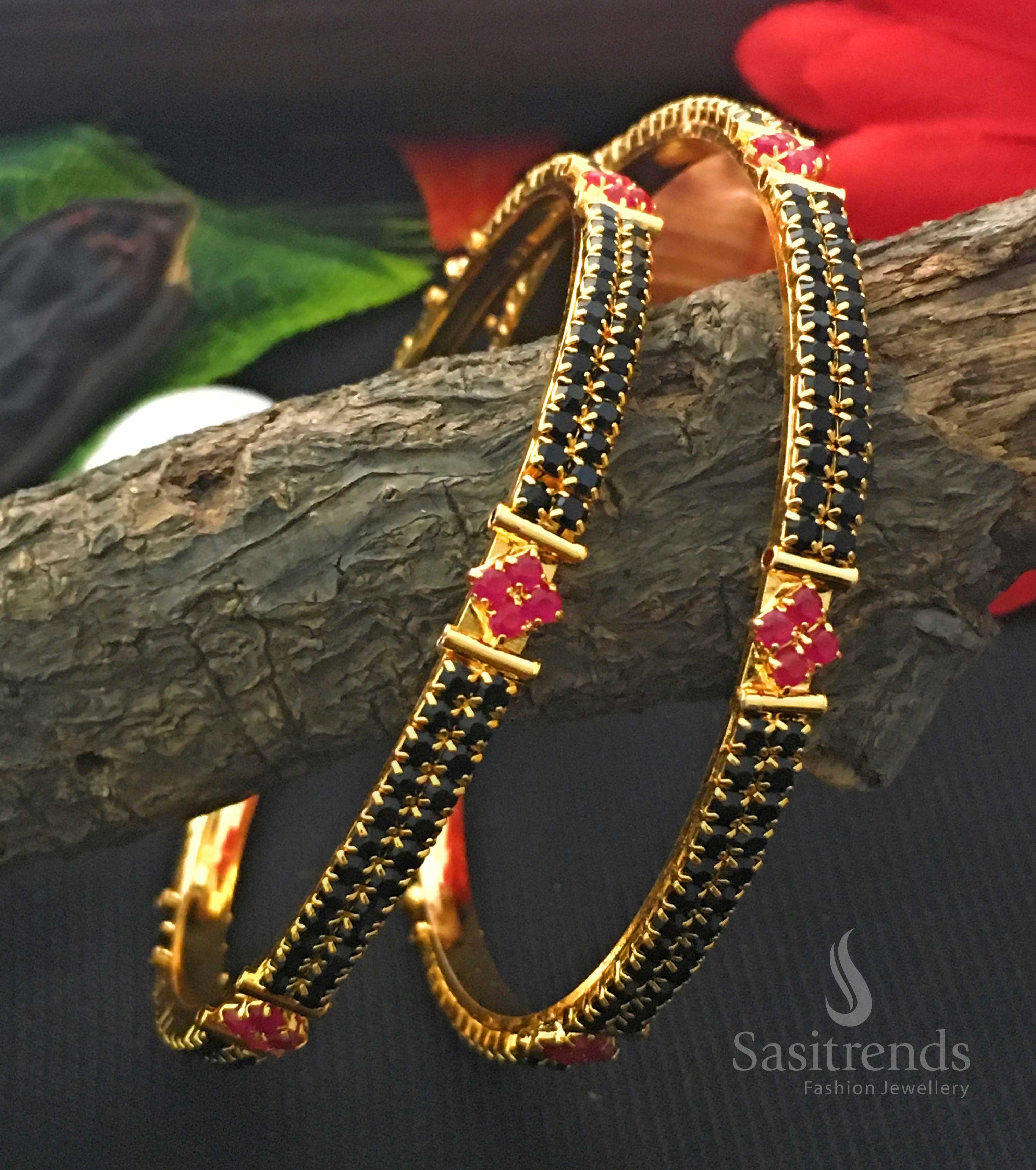 A stunning one gram micro gold-plated black para stones bangles pair, crafted with a classic and timeless jewellery design - Sasitrends