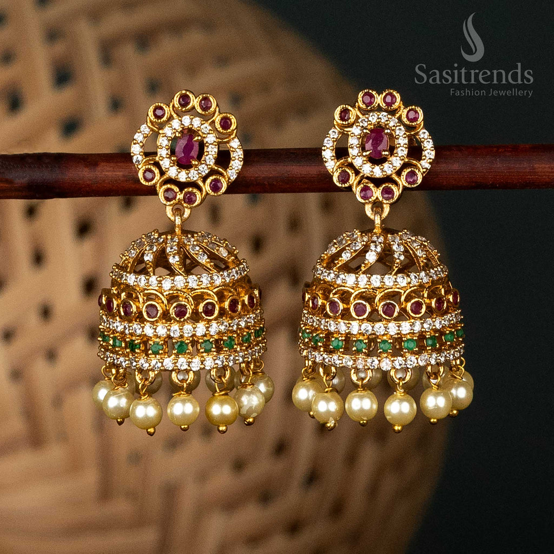 Captivating Matte Gold-Plated Jhumka Earrings with Floral Dome Design, Red and Green Accents, and Pearl Hangings for Festive Occasions - Sasitrends