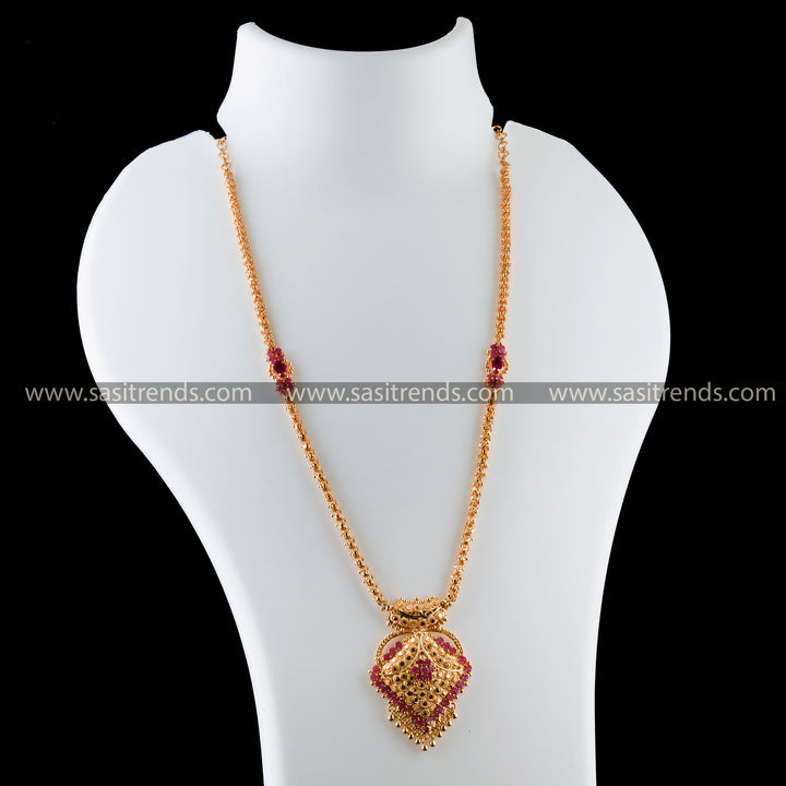 Ruby floral motif pendant adorning a micro gold-plated necklace, a blend of tradition and luxury