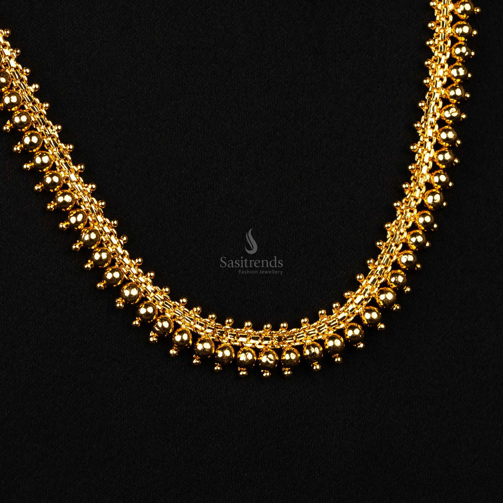 Close-up view of intricate craftsmanship on the gold necklace - Sasitrends