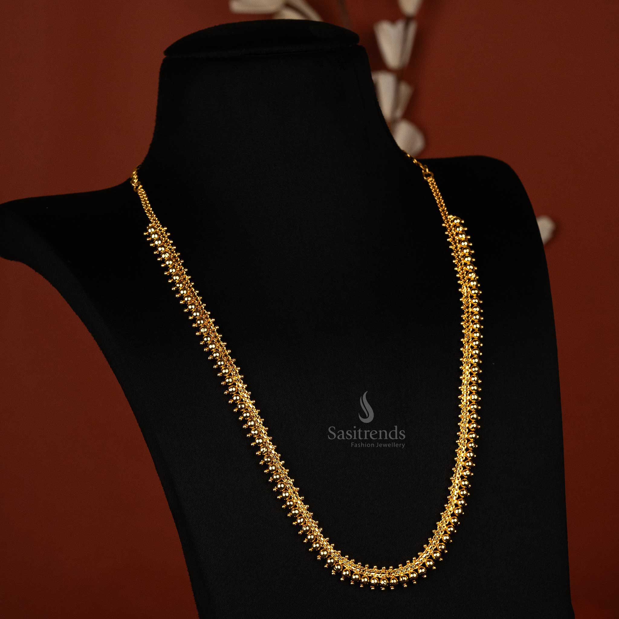 Elegant micro gold plated big ball long necklace on display - Sasitrends