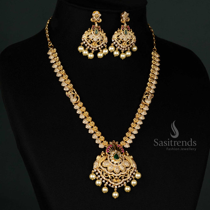 Opulent Temple Jewellery Set in Matte Gold for Brides featuring Peacock Motif, American Diamonds, and Hanging Pearls - Sasitrends