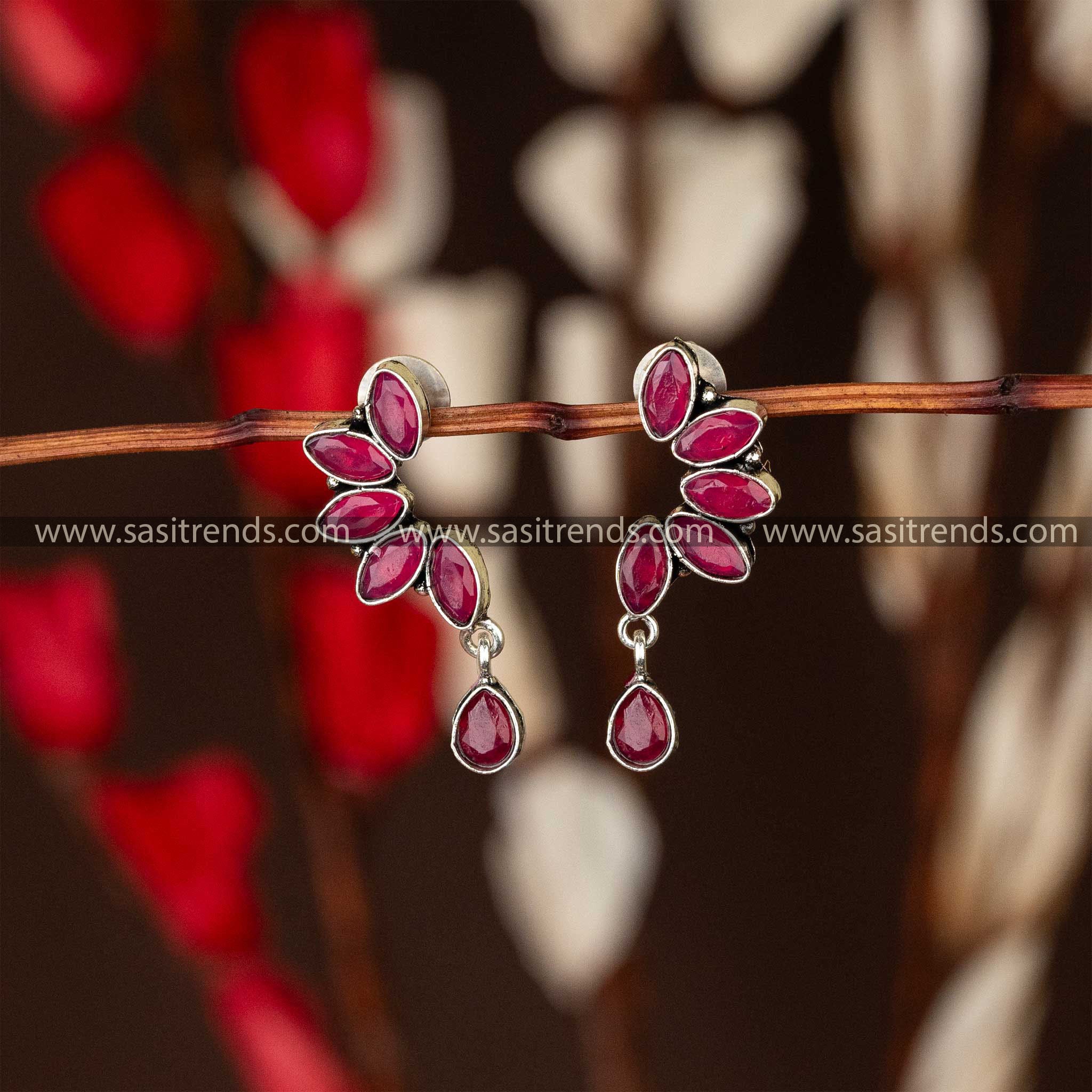 Trendy oxidised earrings with ruby marquise stones in leaf designer navarathiri special elegant