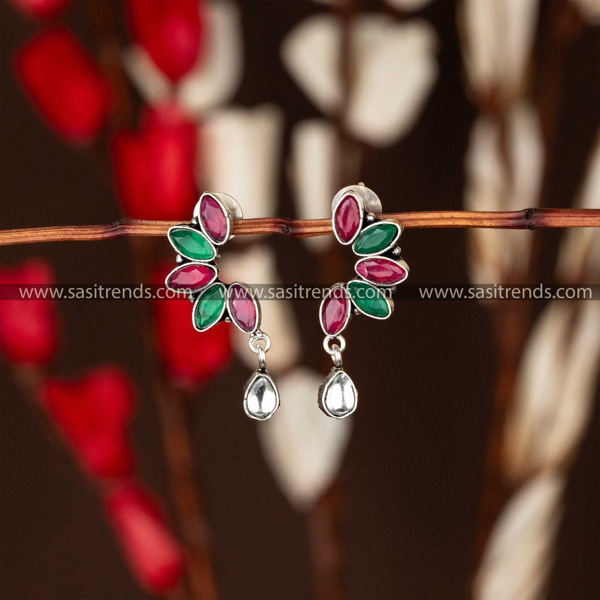 Latest oxidised earrings with ruby and emerald marquise stones in leaf design and teardrop accent