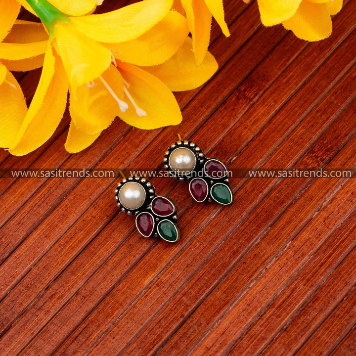 Latest oxidised earrings with central pearl and cascading ruby green waterdrop accents navarathiri elegance