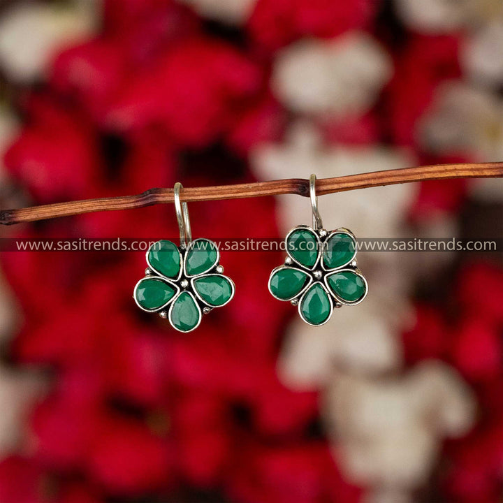 Trendy oxidised petal-shaped earrings with green stone accents on fishhook backs navarathiri special