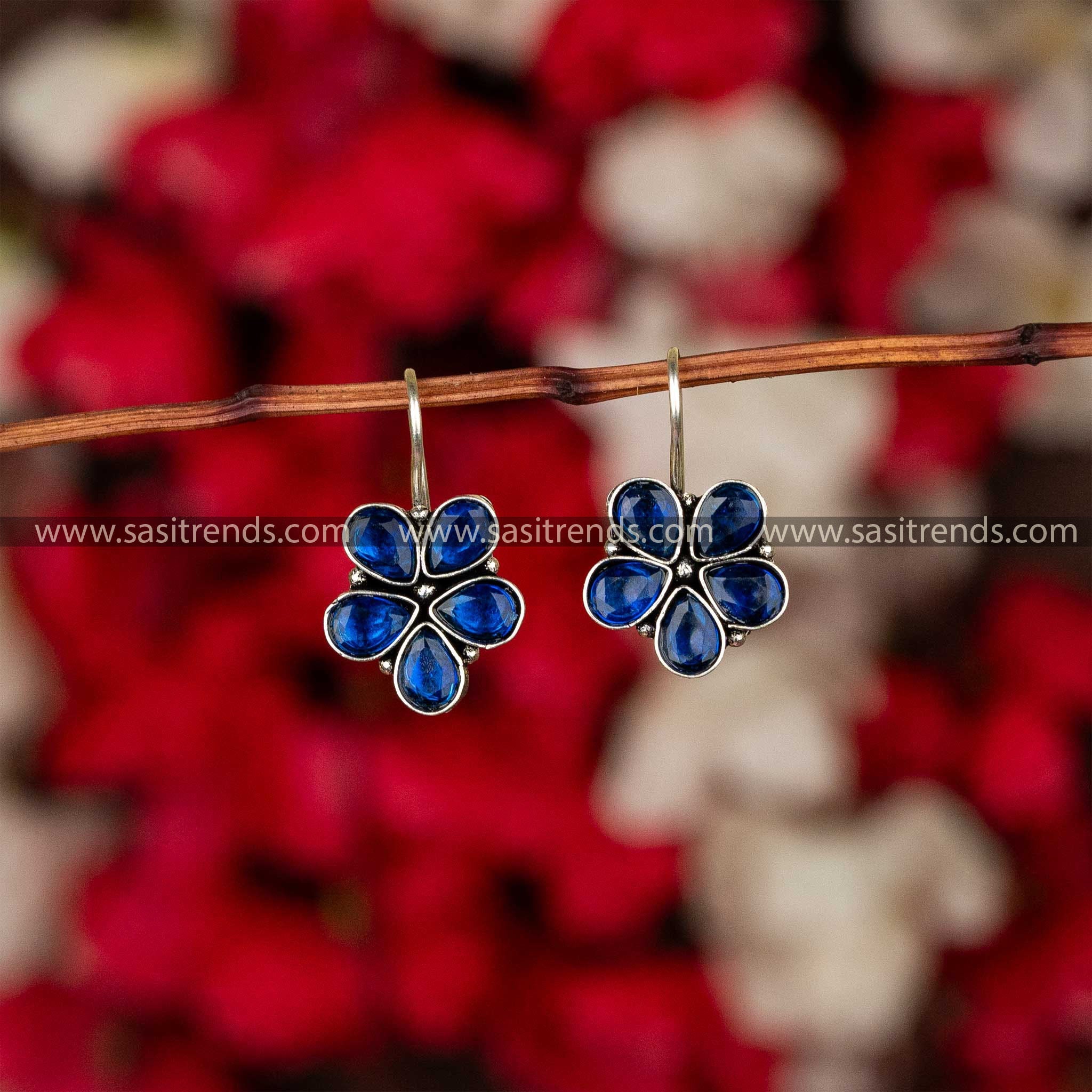 Oxidised petal-shaped earrings with blue stone accents on fishhook backs navarathiri special sasitrends